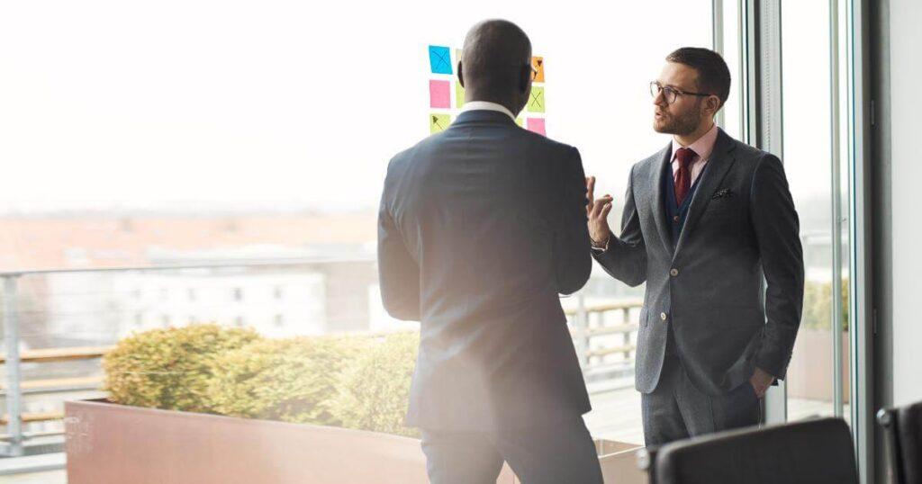 two men discussing retained executive search process