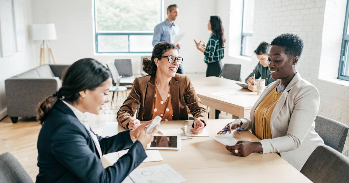 group of three accounting professionals around a table