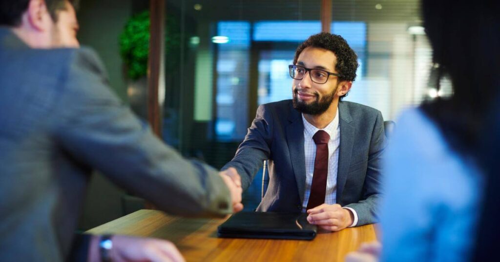 accounting finance candidate shaking interviewer's hand